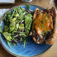 Plant-based Philly Cheesesteak with Greens Salad  at The Street Eatery in Calgary