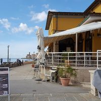 Outdoor and indoor seating at Caffe Teater in Piran
