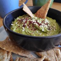 green hummus with spinach, mint, hemp seeds, and homemade spelt crackers.  at Cafe Parallel 43 in Sofia