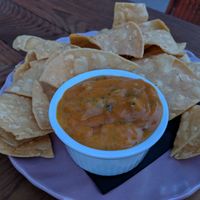 Carrot Queso with chips at Strange Town in Milwaukee