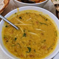 Spiced yellow Dal with slices of lemongrass at Yashoda Indian Restaurant in Nha Trang