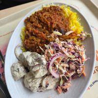 Spiced aubergine and lentil stew with Mediterranean potato salad and zesty slaw at Eden Project in St Austell