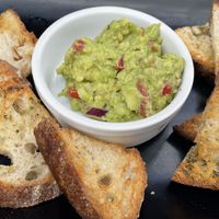 Garlic and guacamole crunch  at Wulf & Lamb Chelsea in London