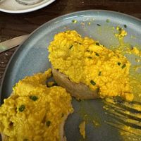 Scrambled tofu with harissa on a muffinn  at Wulf & Lamb Chelsea in London