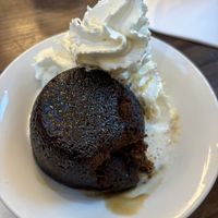 Sticky toffee pudding - notice the less on a teaspoon of syrup.   at Wulf & Lamb Chelsea in London
