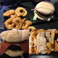 Ultimate burger, rasher and blue cheezly burger, onion rings and cheezy chips at The Pipeline in Brighton