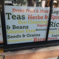 Signage on window at Village Wholefoods & Bulk Foods in Marrickville