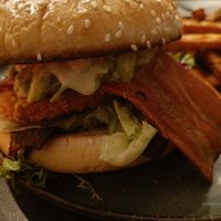 Burger with lots of add-ons at Backstage Vegan Kitchen in Rotterdam