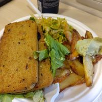 Part 2 of the complete plate. Corn bread, cabbage salad and potatoes with spicy cabbage sauce at Officina Vegana in Naples