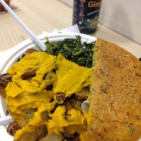 Second part of complete plate, farifritata and sauted greens with potatoes and carrot sauce at Officina Vegana in Naples