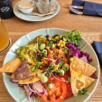 Naked burrito with grenaille potatoes in background at Fryends in Brno