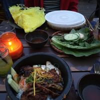 Yellow crepe with tasty green leafs (to make ricepaper rolls)and a "Happy monk"(seitan rice dish) at Con Tho in Berlin