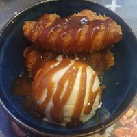 sticky vegan ‘ribs’: Mushroom + soya protein 'ribs' glazed with a sweet + spicy sticky sauce topped with sesame seeds + spring onion at Wagamama - Trafford Centre in Manchester