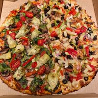 Half Vegetarian (Veggie) Pizza made Vegan style, and Half Vegan Tahitian Treat.  So good!! at Bluebird Pizza in Roseburg