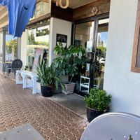 Storefront for A’a Roots - patio seating in frontt of  at a'a Roots Health Cafe in Lahaina