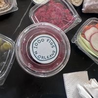 Hibiscus tea with shot of the pickled veggies (so good) that came with Vegan Feast.  at 1000 Figs in New Orleans