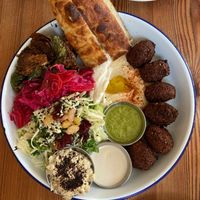 Veggie plate with Brussels sprouts, pickled veg, baba, and extra falafel added at 1000 Figs in New Orleans
