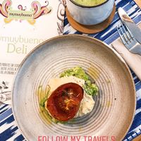 Avocado mash, hummus and tomato w/ coconut milk matcha latté  at mymuybueno Deli in Mallorca