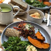 Asian coleslaw, falafel, greens, maple roasted sweet potato, hummus, seeded bread, and a matcha latte... heaven! at mymuybueno Deli in Mallorca