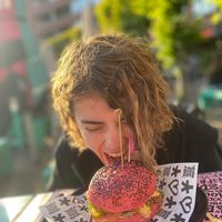 Me ATTACKING this amazing burger at Vegan Junk Food Bar - De Pijp in Amsterdam