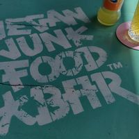 Bright outdoor tables at Vegan Junk Food Bar - De Pijp in Amsterdam