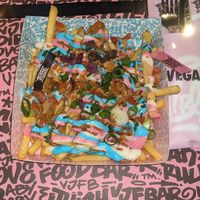 iconic rainbow loaded fries at Vegan Junk Food Bar - De Pijp in Amsterdam