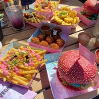 We ordered a lot of food to share. Daddy and the Cheezy Smash burgers. Mac & Cheeze Betterballs, Pnut Thai Chik’n Betterballs. And smiley faces.  at Vegan Junk Food Bar - De Pijp in Amsterdam