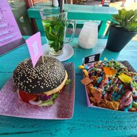 'Mc Cruelty free' burger; iconic rainbow fries; fresh mint tea at Vegan Junk Food Bar - De Pijp in Amsterdam