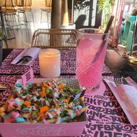 Loaded rainbow fries with Dragonfruit Ice-T at Vegan Junk Food Bar - De Pijp in Amsterdam