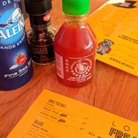 mini sriracha on the table was so cute at Vegan Junk Food Bar - De Pijp in Amsterdam