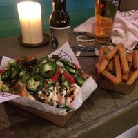 Loaded fries and a side of chickpea fries at Vegan Junk Food Bar - De Pijp in Amsterdam