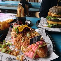 Pinky Bratwurst XL, Daddy Mc Chik'n, Mediterranean Cheeze Springrolls and Waffle Fries at Vegan Junk Food Bar - De Pijp in Amsterdam