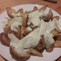 Potato wedges with dill sauce at Krowarzywa in Gdansk