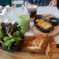 Haskap Berry Grilled Cheese with Mixed Greens. Side of hashbrowns. Iced matcha latte and americano.  at LOV in Laval