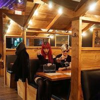 La Carmina inside the Twin Peaks cabin booths at vegetarian restaurant Black Lodge Broadway.  at The Black Lodge - Broadway in Vancouver