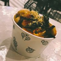 Mac n’ cheese topped with shiitake bacon and vegan parm at Beatnic - Rockefeller Plaza in New York City