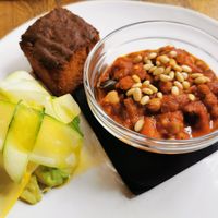 Cornbread, chickpea, tomato & aubergine ragu with courgette ribbons, avocado & toasted pine nuts at The Old Bicycle Shop in Cambridge