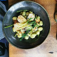 Pan-fried spinach gnocchi, miso butter, bok choi, green beans, toasted sesame, crispy shallots at The Old Bicycle Shop in Cambridge