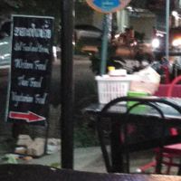 Seats at stret ok not much traffic at Lisa's Cafe in Savannakhet