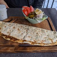 Lahmacun served with pickles and a salad at VegaNarsist - Nişantaşı in Istanbul