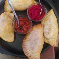 Piroski with cabbage on the left & with potato on the right at Cafe Bar 67 in Athens