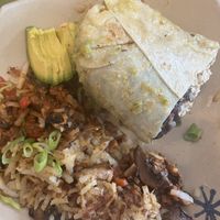Half a Burrito subbing eggs for tofu added mushrooms and avocado and half a Spud skillet with mushrooms, peppers and soyrizo.    at Snooze - Larimer St in Denver
