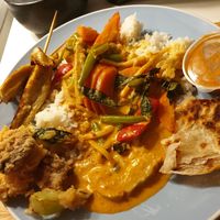 Crunchy veggies, red curry, seitan skewers w/satay, roti at Madame K's Vegetarian - Williamstown in Williamstown