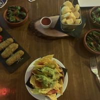 Pea and mint croquettes, nachos, patatas bravas, peppers at FAMA Aperitif Bar in Benalmadena