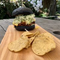 Blackjack - BBQ Jackfruit burger. Comes with a side of corn chips that are perfect to eat the extra BBQ Jackfruit with that falls from your burger! 😊 at Okere Falls Store in Rotorua