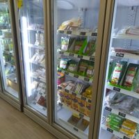 Vegan cheezes in the fridge at 2VShop in Paris