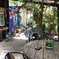 Outdoor seating and bathroom  at Niceness in Nago