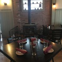 Wood stove seating at Greenhouse Cafe & Tavern in Burlington