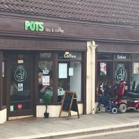 Long shopfront - lots of light inside. at Pots in Falkirk