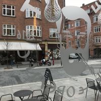 View from restaurant, with restaurant logo in window. at We Feat Pure Organic in Aalborg
